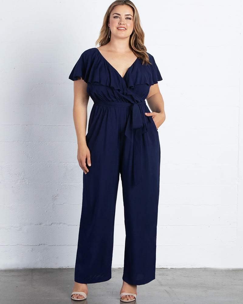 Front of a model wearing a size 0X Odessa Ruffle Jumpsuit in NOUVEAU NAVY by Kiyonna. | dia_product_style_image_id:227431